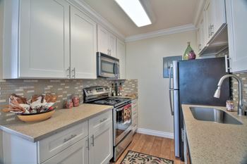 Modern kitchen with stainless steel kitchen at Sunnyvale Town Center Apartments